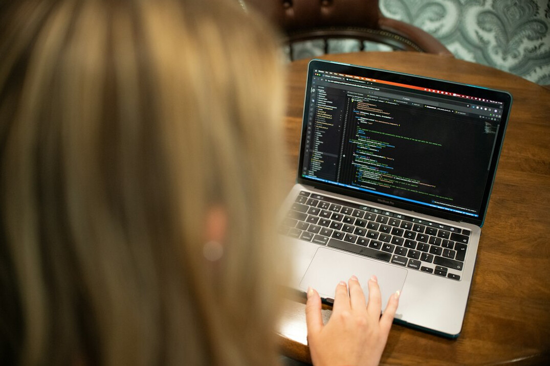croatian student coding on laptop