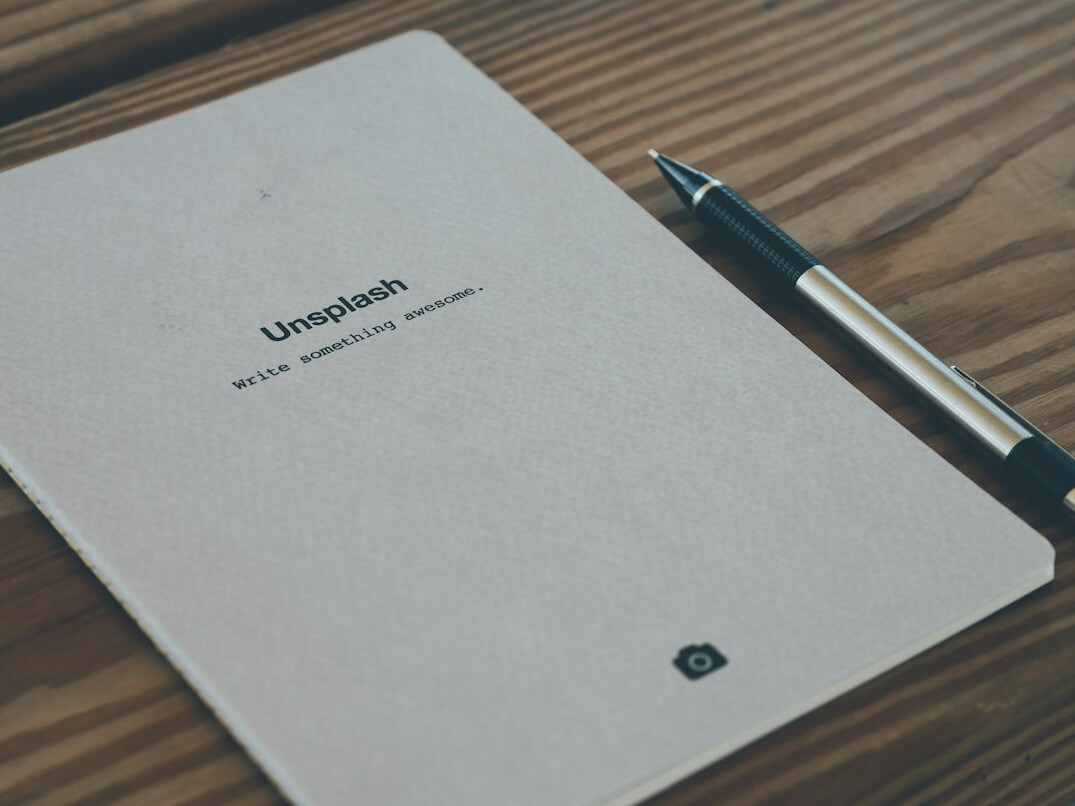 Notebook with handwritten algorithm notes and a pen