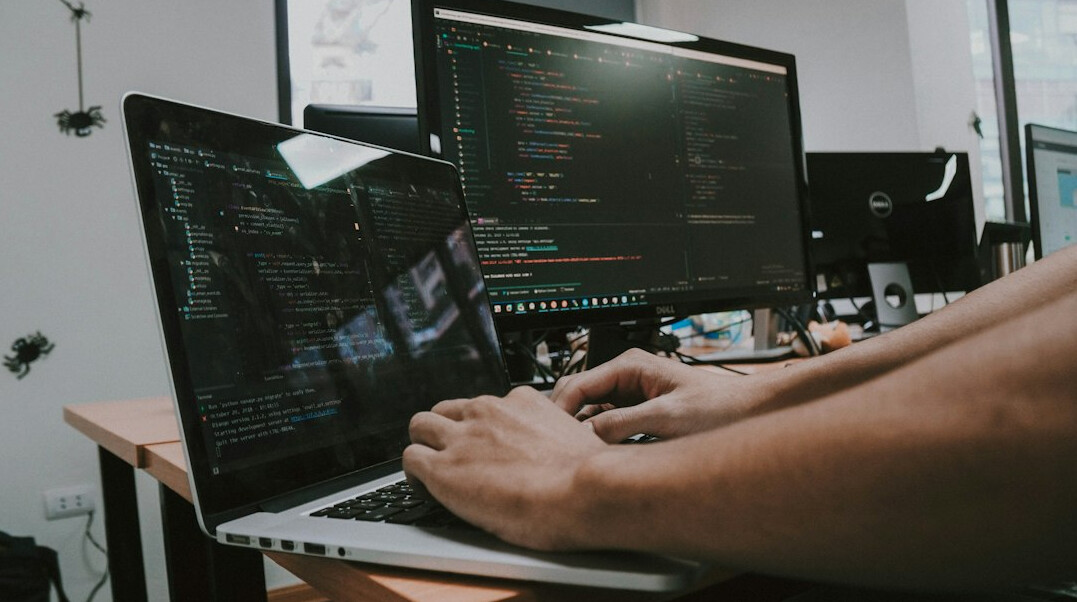 programmer reviewing code on screen