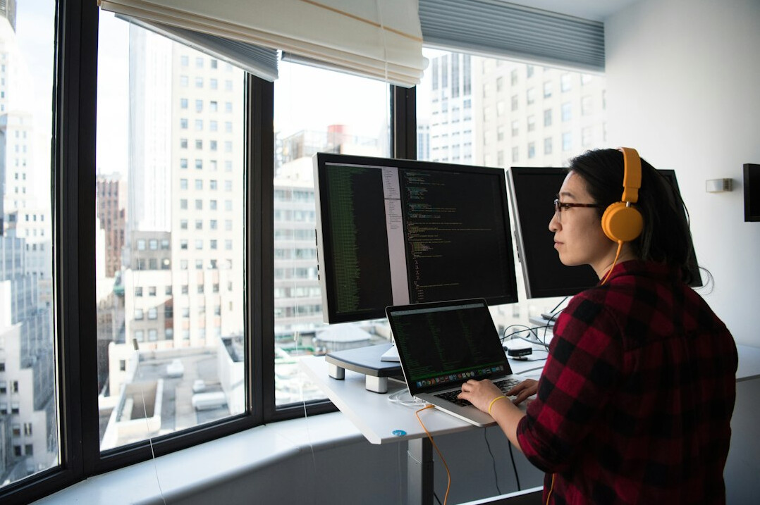 woman coding happily